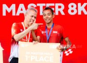 Agus Prayogo berlari di lintasan dalam ajang Merdeka Run 2026 di kawasan Istana Merdeka.