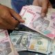 Tampilan layar grafik pergerakan nilai tukar mata uang Rupiah terhadap Dolar AS