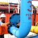Aktivitas bongkar muat peti kemas di pelabuhan utama Indonesia untuk kebutuhan industri nasional.